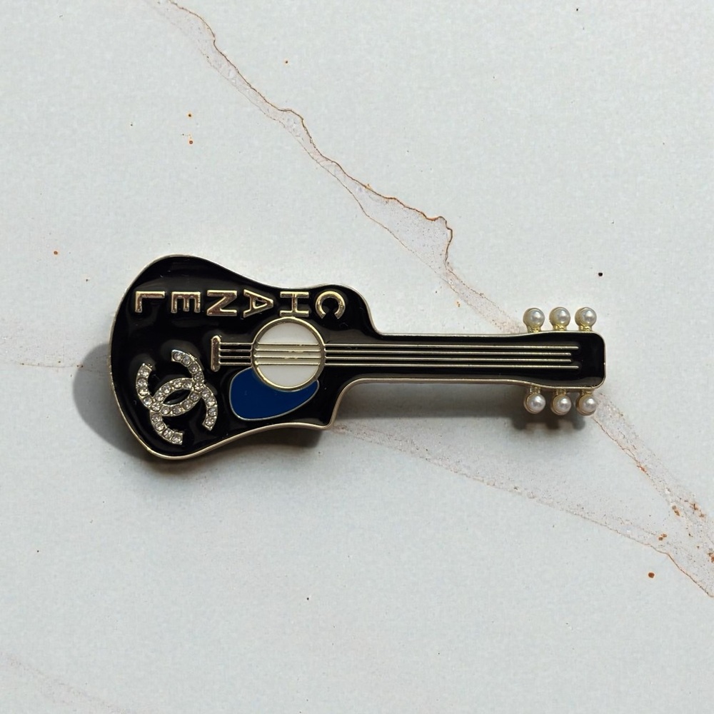 Chanel guitars brooches made with zipper pulls! Gold only